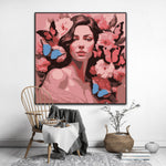 This enchanting portrait radiates with the softness and vibrancy of pink, celebrating femininity, grace, and transformation. The central figure, a serene woman, is adorned with delicate flowers and surrounded by fluttering butterflies, symbolizing beauty, renewal, and the cycles of life.