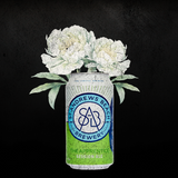 Fine art print featuring St Andrews Beach Brewery's vibrant beer cans, including 6 Furlongs Pale Ale and The Strapper Lager, artfully arranged among fresh, colorful flowers. A visually striking composition celebrating the fusion of local craft brewing heritage with natural beauty.